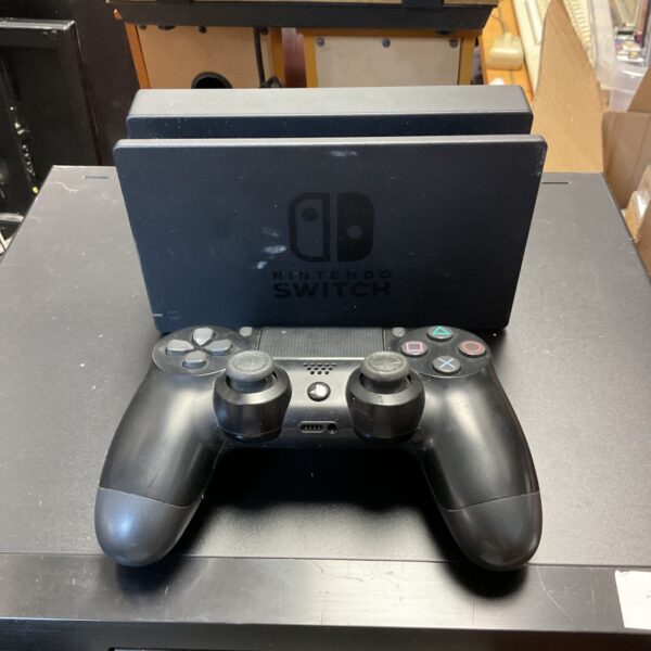 Nintendo Switch dock and PlayStation 4 controller gaming bundle.