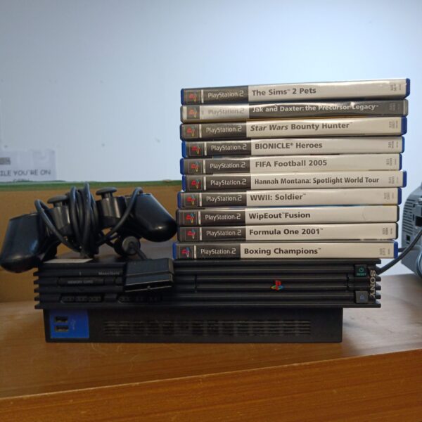 PlayStation 2 console bundle with games for retro gaming.