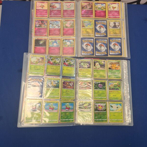 Front view of a blue Pokemon card album filled with cards.