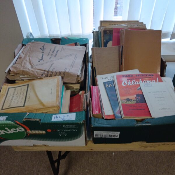 Vintage sheet music lot with colourful covers and aged paper.