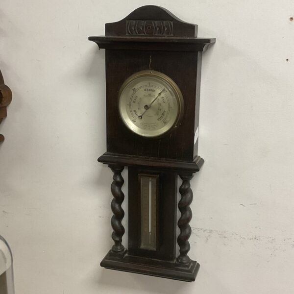 Antique Committi of London barometer with carved wooden case.