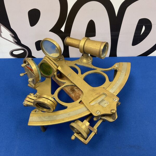 Vintage brass sextant for nautical navigation, detailed view.