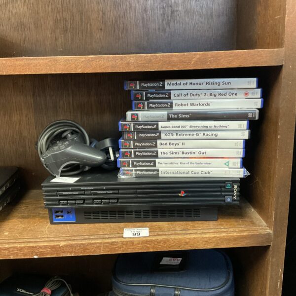 Sony Playstation 2 console with games including Call of Duty and The Sims.