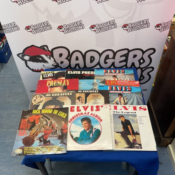 Lot of vintage Elvis Presley vinyl records for collectors.