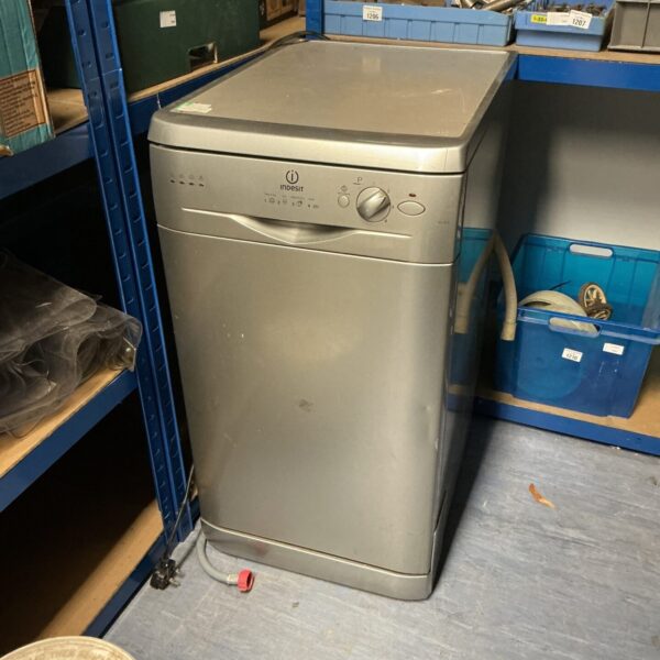 White Indesit slimline dishwasher, IDL 40 S model, used kitchen appliance.