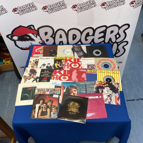 Vintage vinyl records collection including Queen, Duran Duran, and Bob Marley.