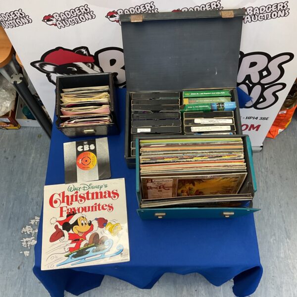 Large lot of vintage vinyl records and cassette tapes for collectors.