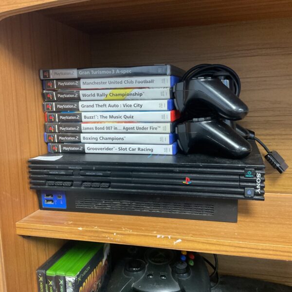 Playstation 2 console bundle with games and controllers.