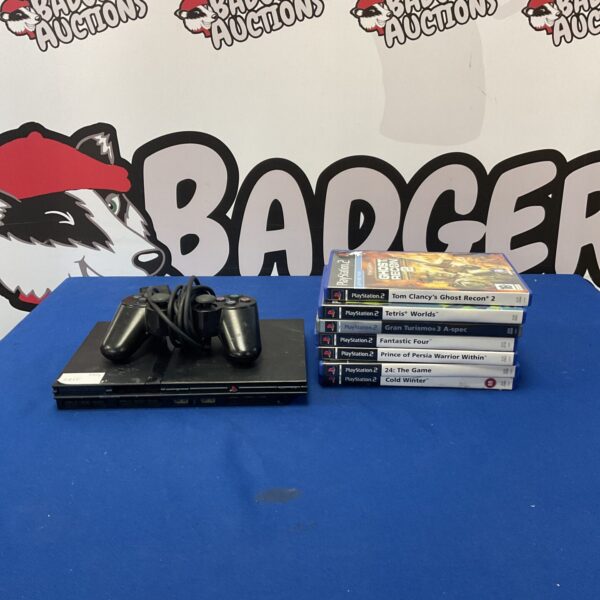 Playstation 2 slim console with a variety of games included.