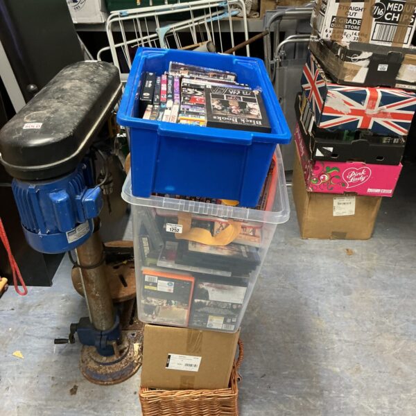 Large DVD collection in a clear storage container, ideal for film enthusiasts.