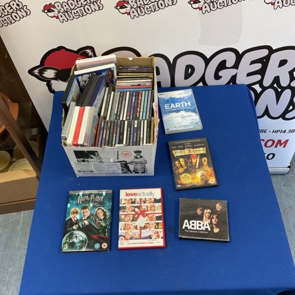 Mixed lot of DVDs and CDs including Harry Potter and ABBA.