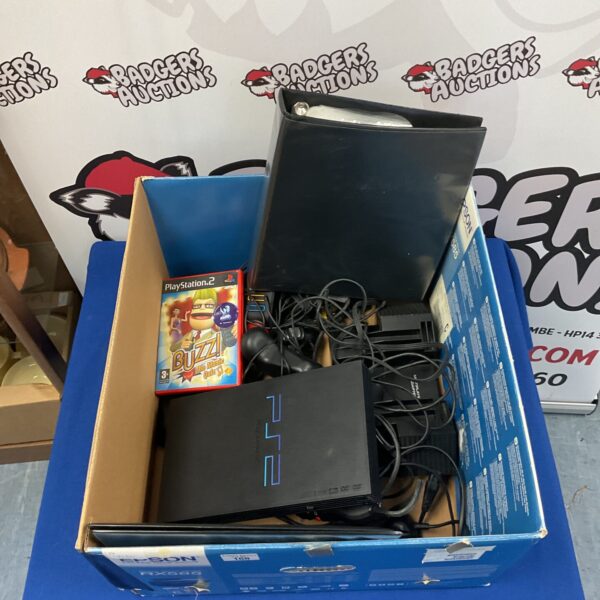 Sony Playstation 2 console with Buzz! game and accessories.