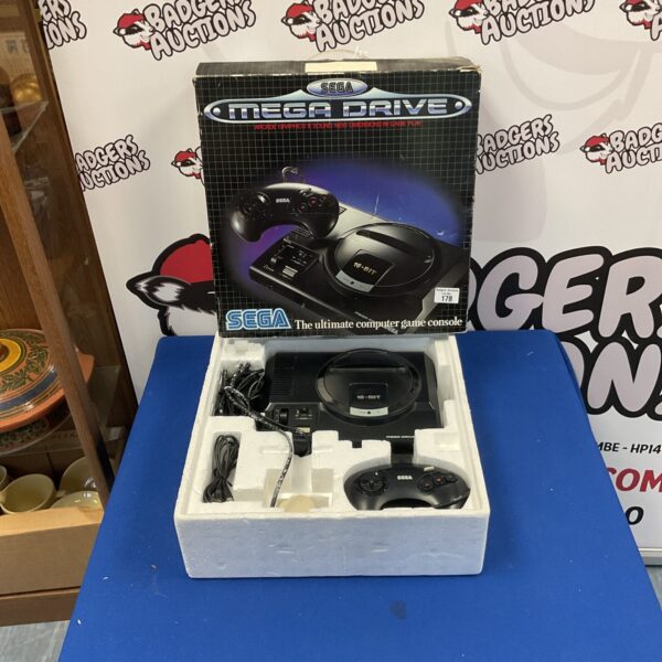 Front view of a vintage Sega Megadrive 16-bit video game console.