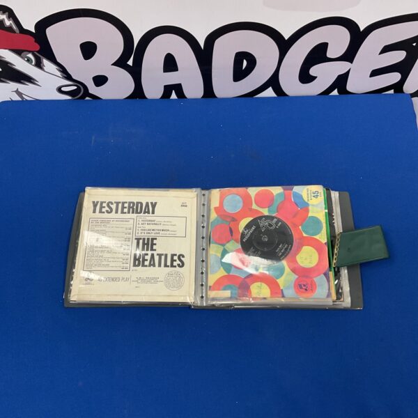 Beatles singles collection in protective sleeves.