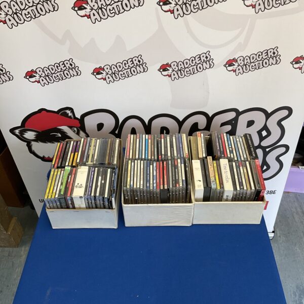 Three boxes filled with a diverse CD collection for music lovers.
