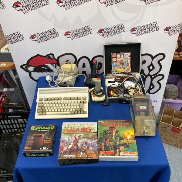 Commodore Amiga A600 with games and joysticks for retro gaming.