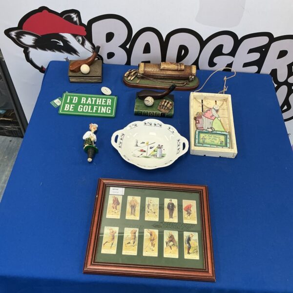 Vintage golf desk top collection with figurines and display.