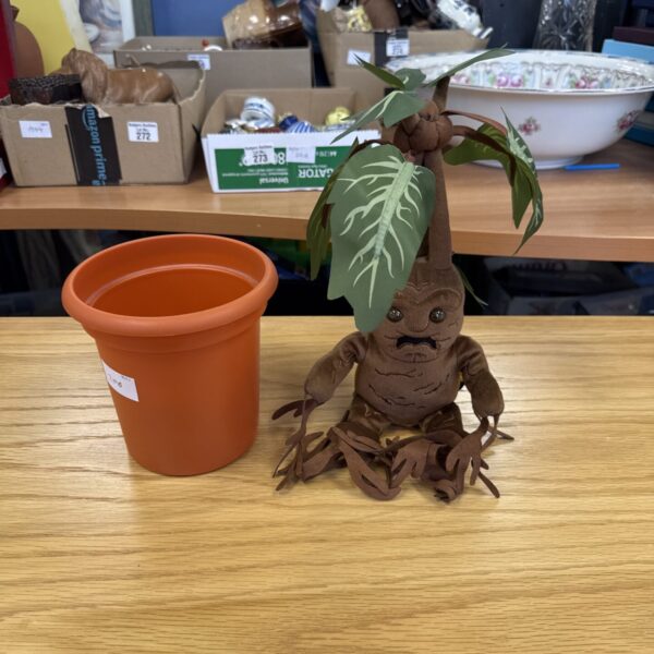 Harry Potter Mandrake toy in a terracotta pot.