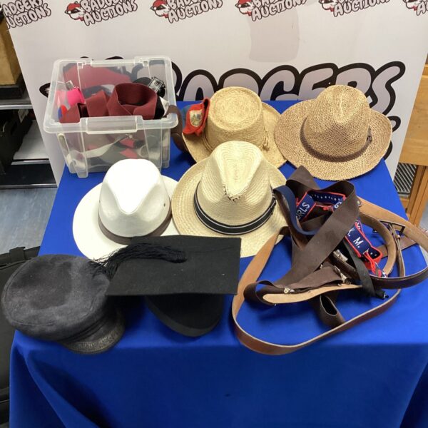 Mixed lot of vintage hats and leather belts for sale.