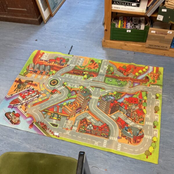 Colourful children’s town play rug with detailed road layout.