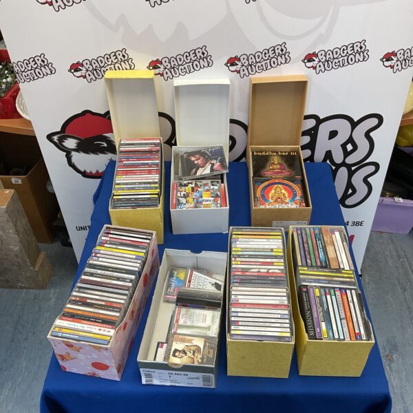 Large collection of music CDs including Buddha, Jeff Buckley, and Ray Charles.