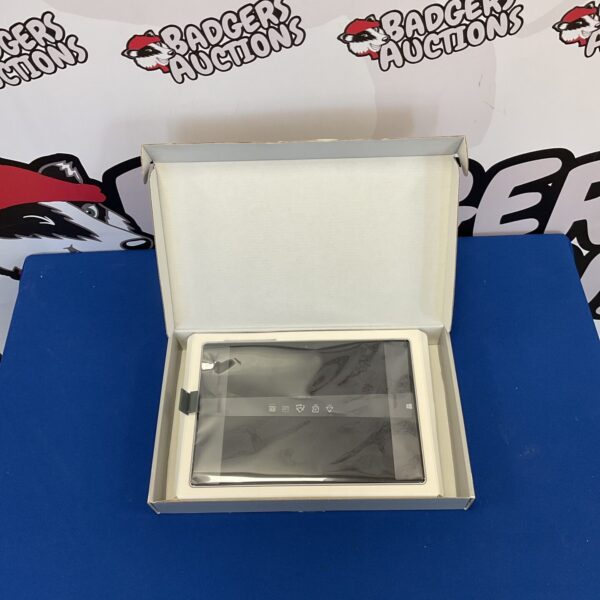 Open box showing Microsoft Surface 3 tablet inside.