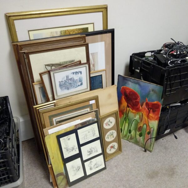 Mixed artwork lot featuring framed prints and paintings.