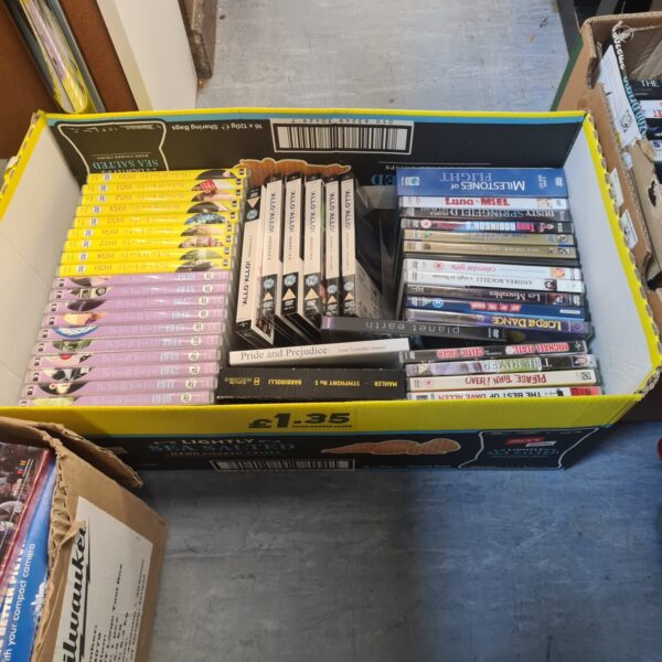 Mixed DVD lot with sealed and opened discs for home entertainment.