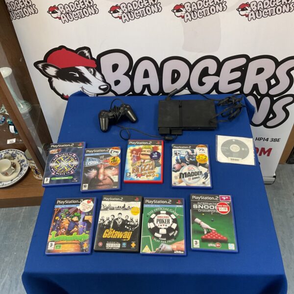 Playstation 2 console and games lot for retro gaming collectors.