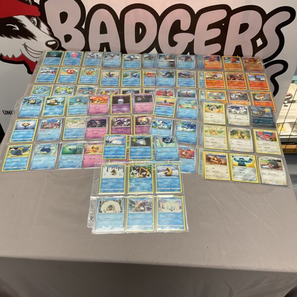 Large lot of sleeved Pokemon trading cards for collectors.