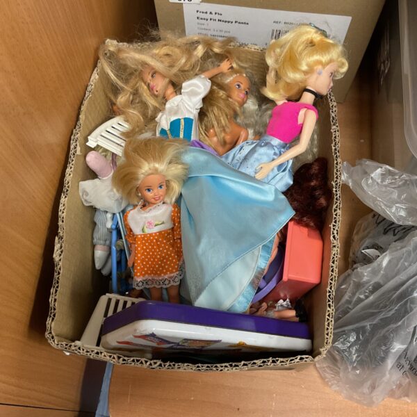 Vintage Barbie dolls and accessories in a colourful lot.