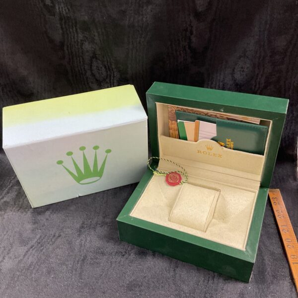 Green reproduction Rolex watch box, front view, empty presentation case.