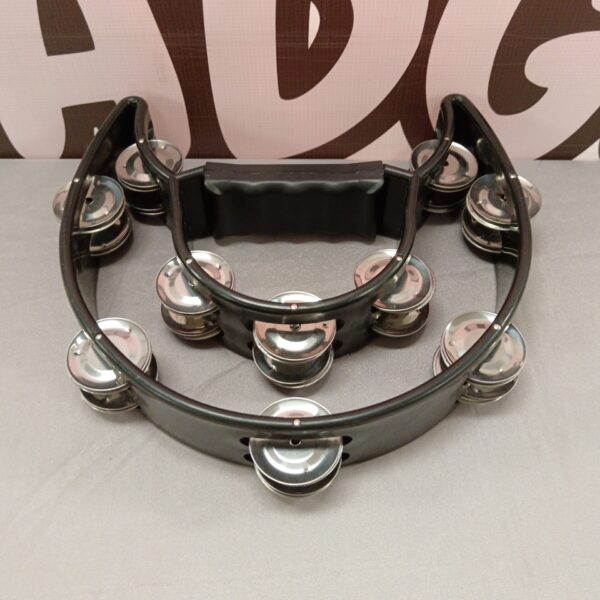 Classic tambourine percussion instrument with silver jingles.