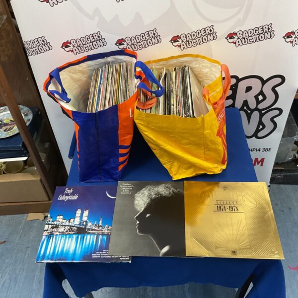 Vintage vinyl record collection featuring Carpenters and Barbra Streisand LPs.