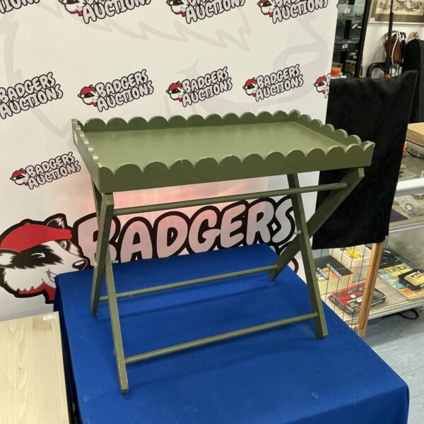 Vintage wooden tray with folding stand for serving or display.