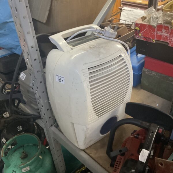 White Argos portable dehumidifier for moisture removal.