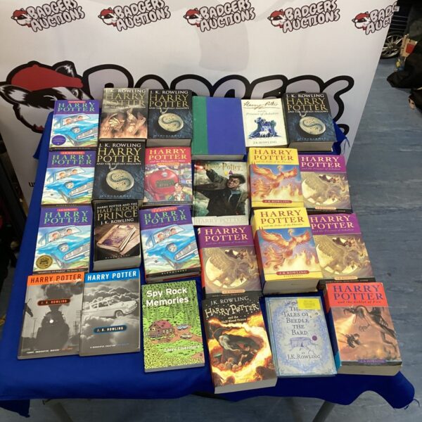 A lot of Harry Potter books by J.K. Rowling.