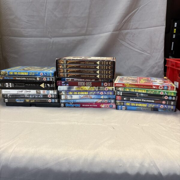 Assorted mixed DVD lot with various movie cases.