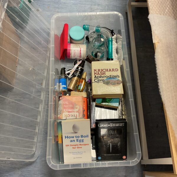 Tray of mixed lot books and cosmetics including Game of Thrones DVD.