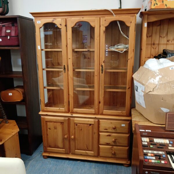 Vintage pine display cabinet with drawers and cupboards.