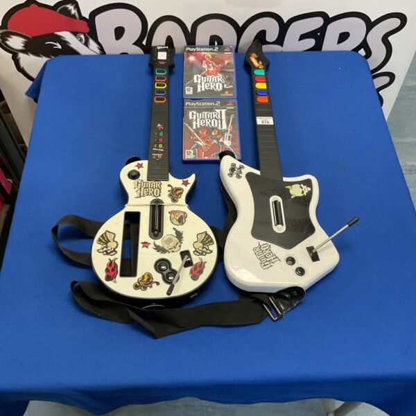 PlayStation 2 Guitar Hero bundle with games and guitars.