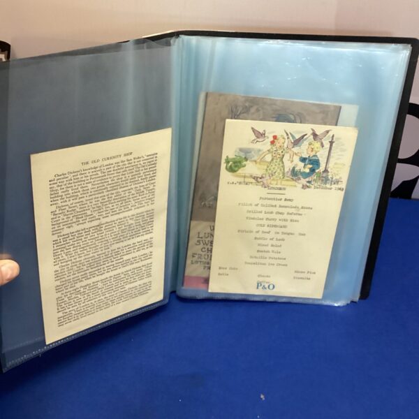 Vintage P&O cruise menus inside a memorabilia folder.