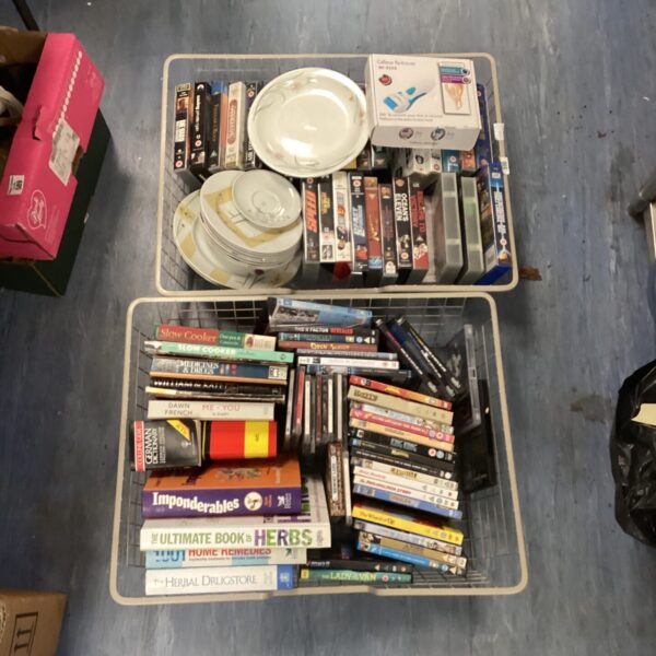 Mixed lot of VHS tapes, DVDs, and Sabichi plates for collectors.