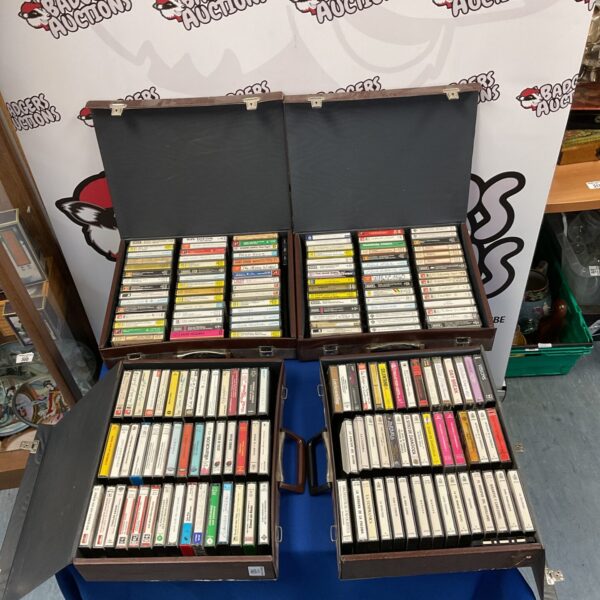 Vintage cassette tape collection in four storage cases.