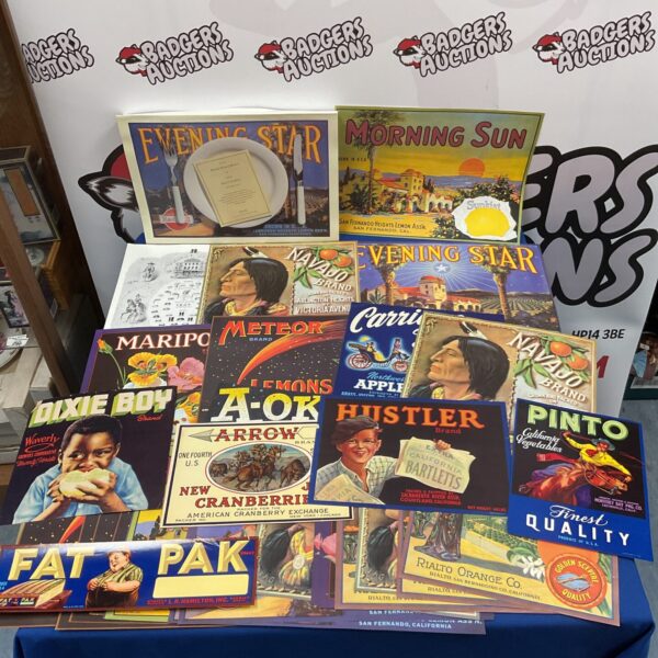 Collection of vintage fruit crate labels including Hustler and Pinto.