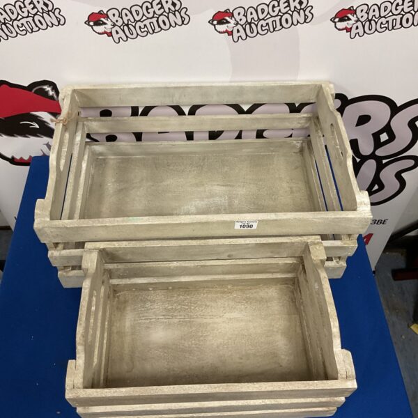 Two vintage wooden crates for storage and rustic decor.