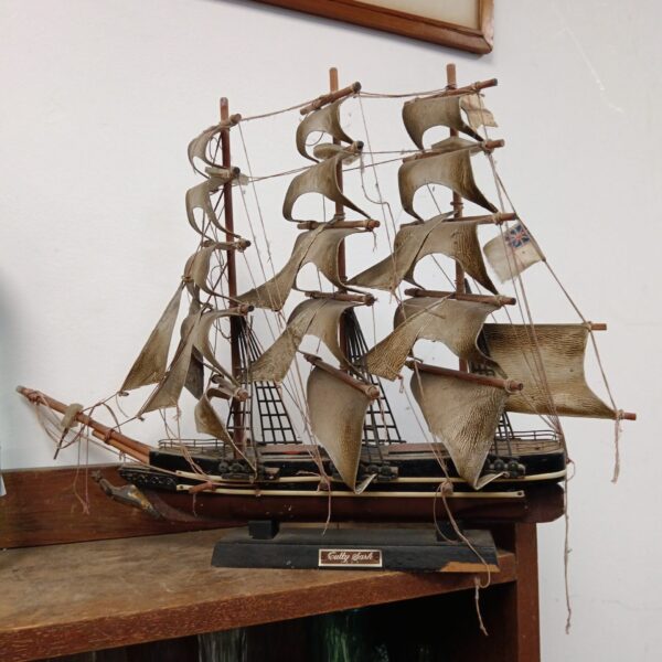 Vintage wooden model of the Cutty Sark sailing ship.