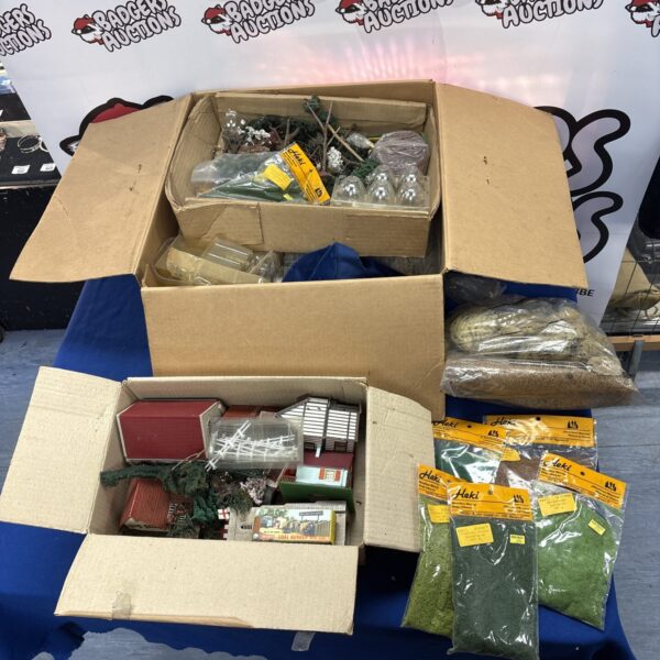 Vintage Hornby OO gauge accessories in a cardboard box.