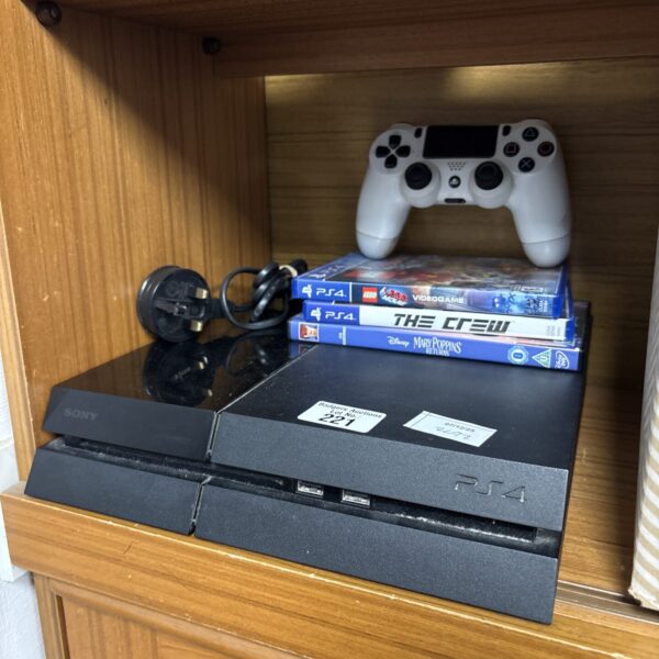 Sony PlayStation 4 console with games and controller displayed.