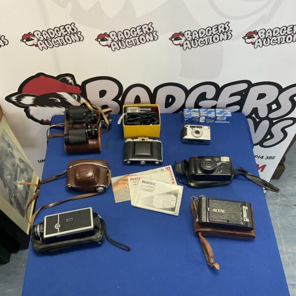 Vintage camera lot featuring a Yashica Electro 35 and binoculars.